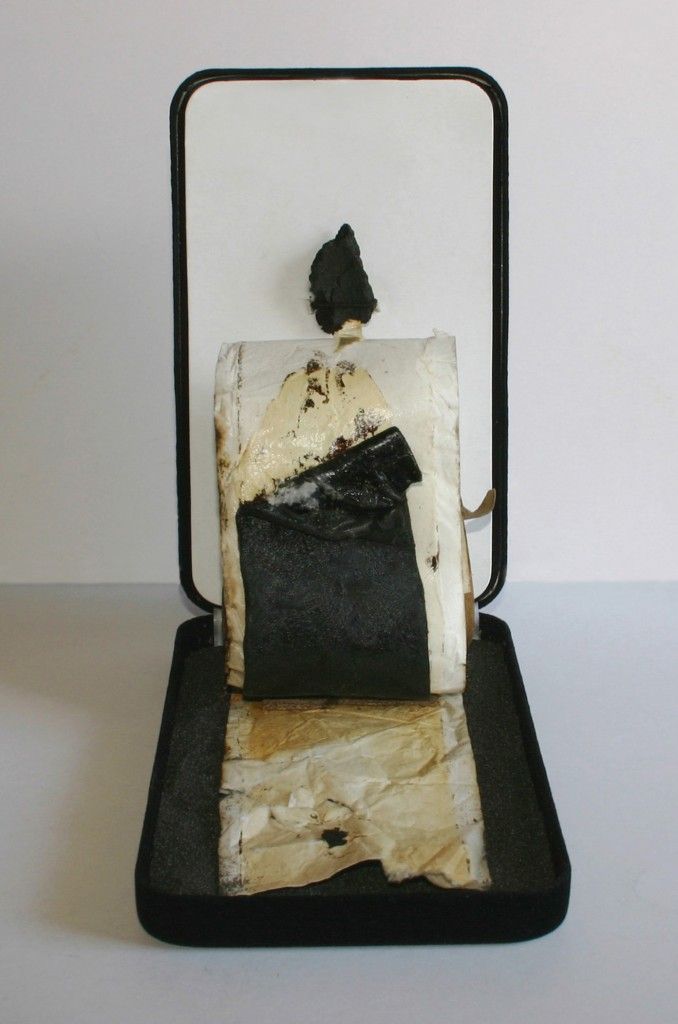 "Black Sand Six"  found object temporary construction - installation  7" x 4.25" x 7.625" ©2011 Gary A. Bibb  (commercial velvet jewelry case, black sand, roofing tar fragment, industrial paper w/ tar)