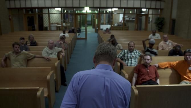 Handout photo of Reinke is shown in this film production still addressing oil-patch workers from his church pulpit in Drafthouse Films' "The Overnighters" in Williston