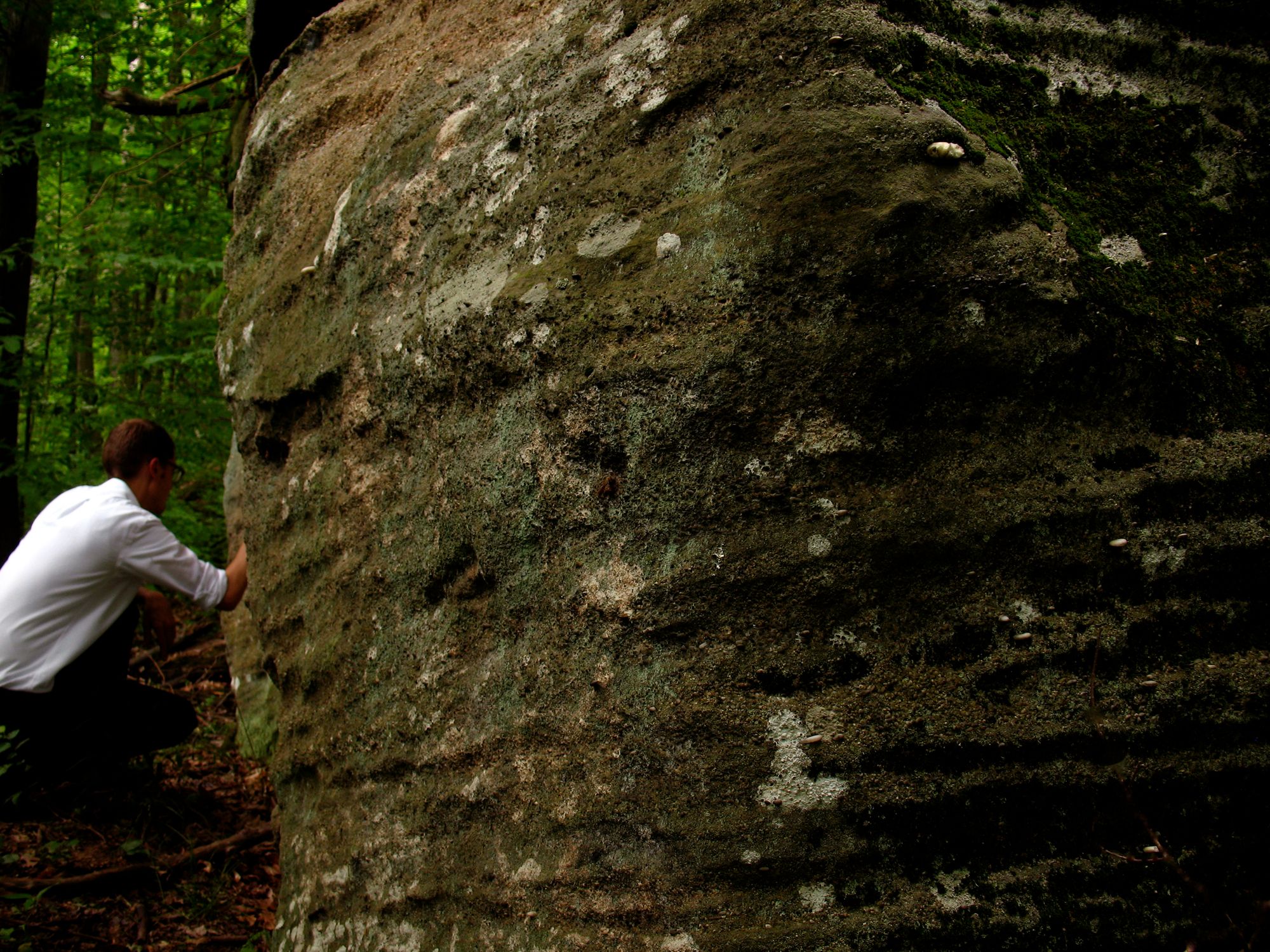 The Gospel of Mark, 2013  perfume  dimensions variable  Near the border of upstate New York, I took a gift of 1.7 fl oz of  perfume and distributed it across the surface of a rock until it was  completely expended.